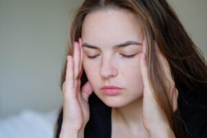 Woman with a headache or migraine